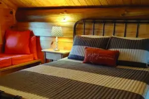 Loft bedroom with setting chair and lamp