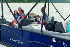 Family on a pontoon boat at Hoosier Hills Marina on Patoka Lake