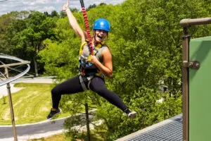Lady jumping off The Drop at Indiana Caverns - a controlled bungy drop.