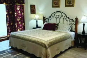 Queen size bed with metal frame at Patoka4Seasons resort