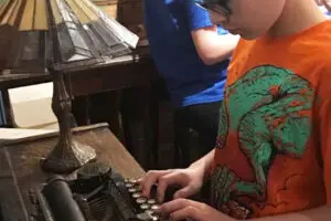 TheDiscoveryCenter-BoyAtTypewriter