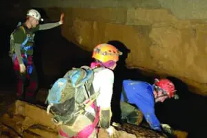 A group exploreing the unrefined parts of Indiana Caverns as part of Deep Darkness explore trip
