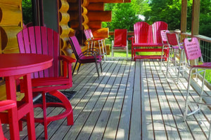 Front deck with red chairs ready for guests.