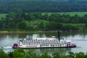 Looking down at the Delta Queen cruising by from the deck of Big Timber River Cabins