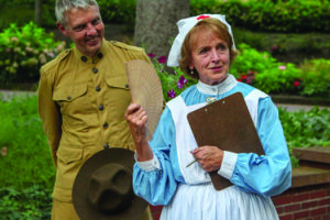 Couple dressed in period clothing, man in military uniform and woman in nurses uniform, conducting a tour at French Lick Springs Resort