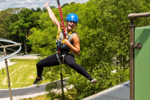 Lady jumping off The Drop at Indiana Caverns - a controlled bungy drop.