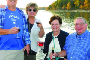 Two couples having a glass of wine on the wine cruise