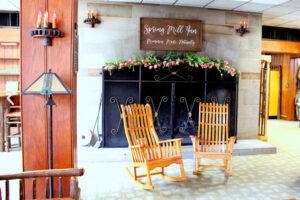 SpringMillInnRockingChairs Comfy rocking chairs in front of iconic Spring Mill Inn fireplace in lobby