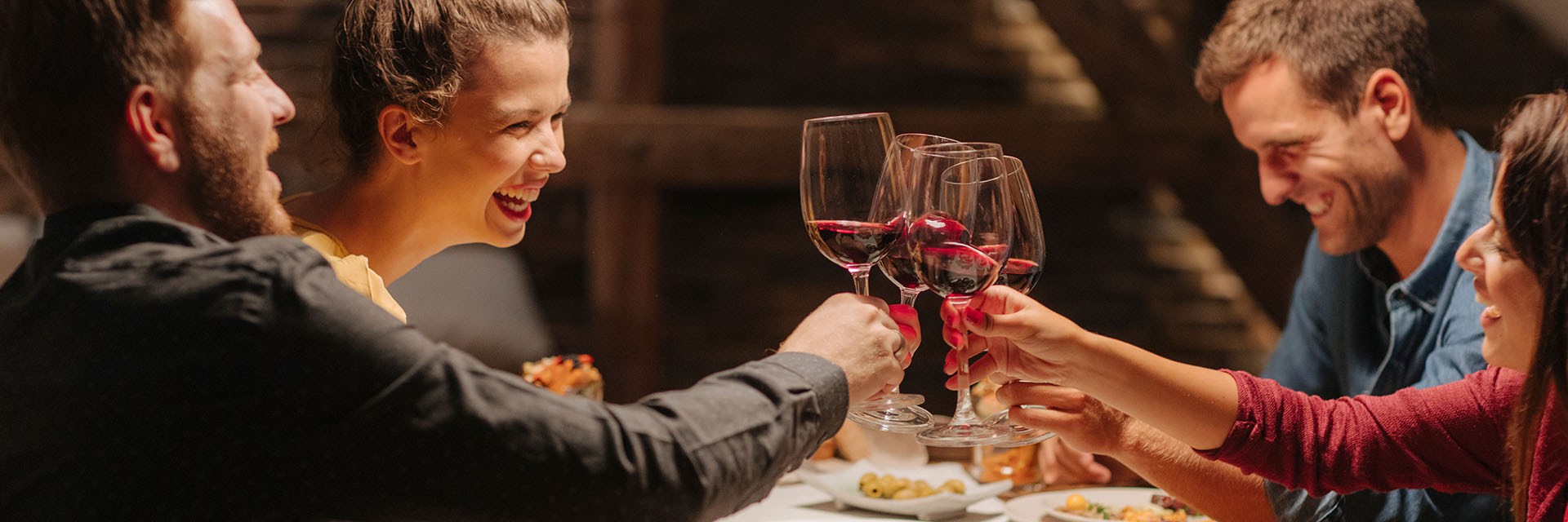 A group enjoying a toast at a winery.