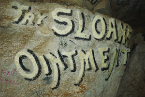 Advertisement, Try Sloan Ointment, painted on rock wall in Wyandotte Cave